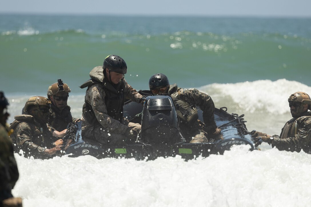 U.S. Marines with 1st Battalion, 1st Marine Regiment, 1st Marine Division, navigate to shore during an amphibious raid course hosted by Expeditionary Operations Training Group, I Marine Expeditionary Force, at Marine Corps Base Camp Pendleton, California, June 21, 2023. The purpose of the amphibious raid course is to train raid force tactics, techniques, and procedures to enhance 1st Bn., 1st Marines’ capabilities in preparation for their deployment with the 31st Marine Expeditionary Unit. (U.S. Marine Corps photo by Cpl. Garcia)