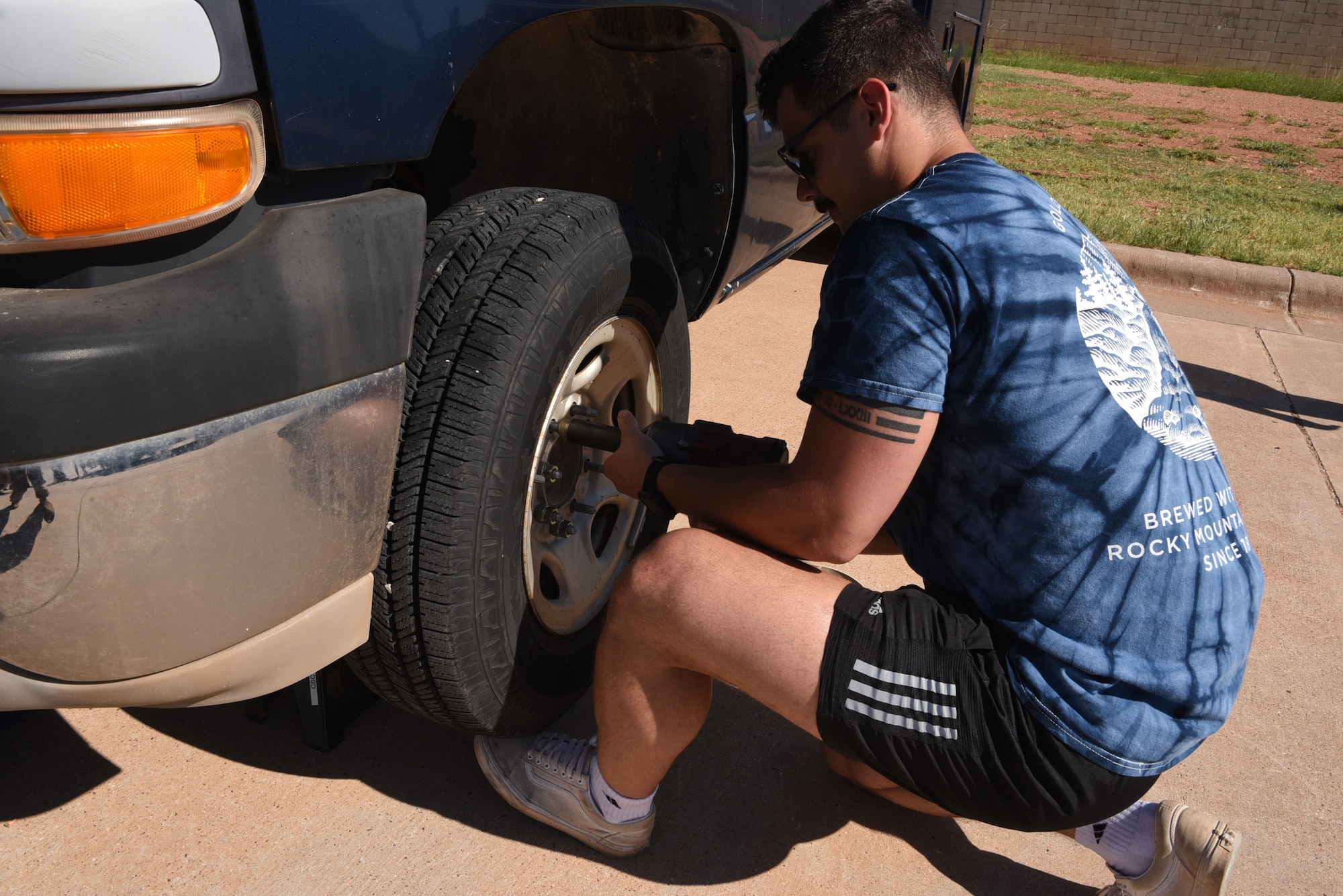 Senior Airman Garrett Mott, 7th Logistics Readiness Squadron fire truck and refueling maintenance mechanic, changes a tire during the LRS Rodeo at Dyess Air Force Base, Texas, June 28, 2023. This is the first rodeo event for the 7th LRS at Dyess, held in celebration of National Logistics Day. (U.S. Air Force photo by Senior Airman Sophia Robello)