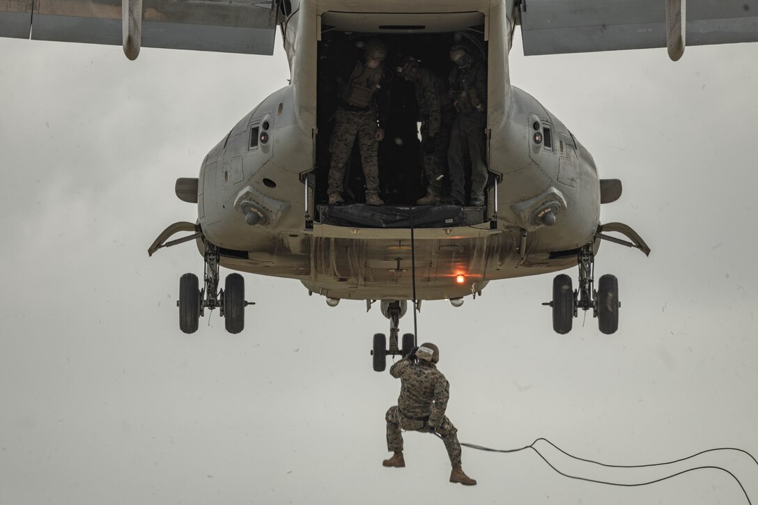 U.S. Marine Corps Cpl. Shawn Voehringer, an electrical equipment engineer with 1st Air Naval Gunfire Liaison Company, I Marine Expeditionary Force Information Group, rappels out of an MV-22 Osprey during a helicopter rope suspension techniques course hosted by Expeditionary Operations Training Group, I MEF, at Marine Corps Base Camp Pendleton, California, June 14, 2023. The helicopter rope suspension techniques course creates HRST masters which are capable of supporting fast rope, rappel, and special patrol insertion/extraction operations from any U.S. Marine Corps helicopter and tiltrotor aircraft as a means to insert and extract ground forces into or from rough terrain and urban areas. Voehringer is a native of Beckley, West Virginia. (U.S. Marine Corps photo by Cpl. Gurule)