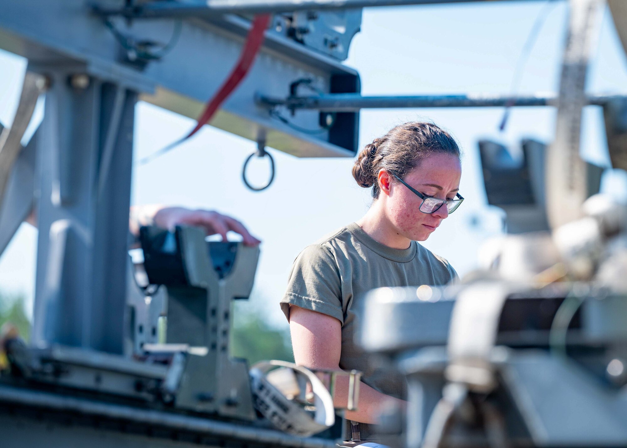 An Airman inspects the integrity of the missiles.