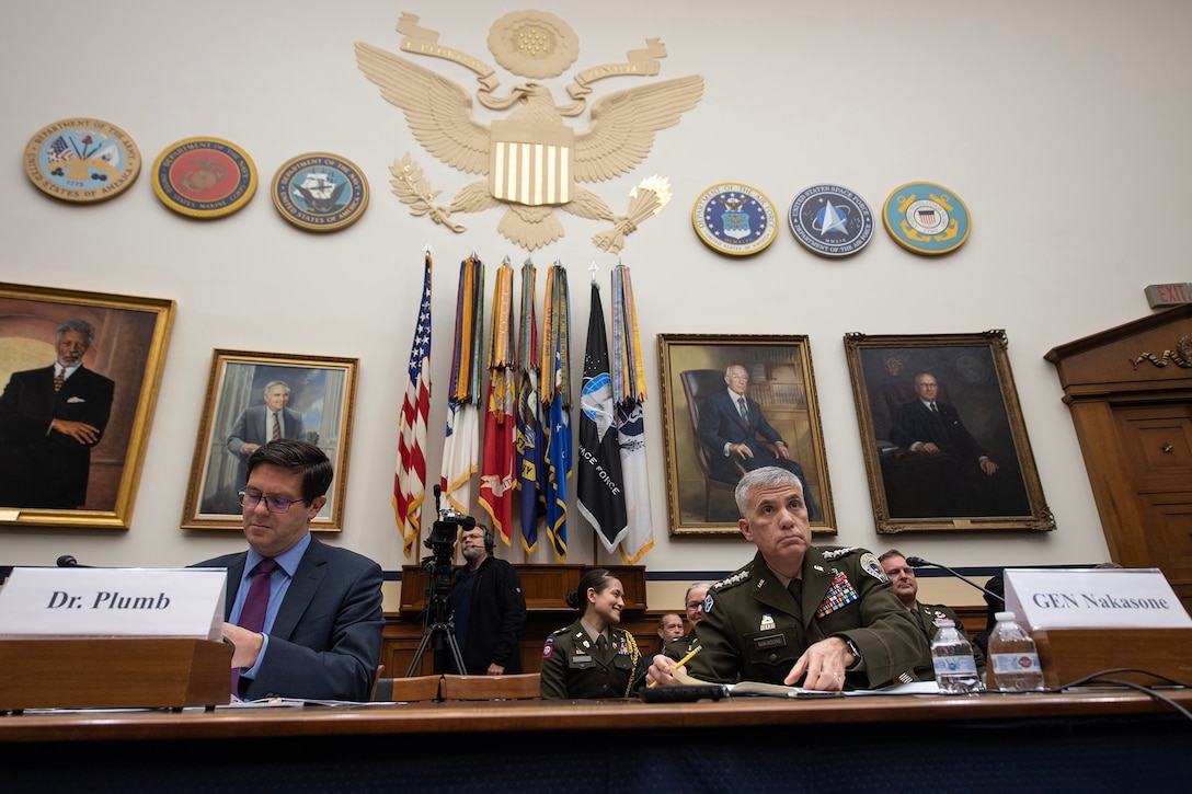 Army Gen. Paul Nakasone, commander of U.S. Cyber Command,  and Assistant Secretary of Defense John Plumb prepare their testimony for the House Armed Services Committee in Washington, D.C. March 30, 2023. (DoD photo by EJ Hersom)