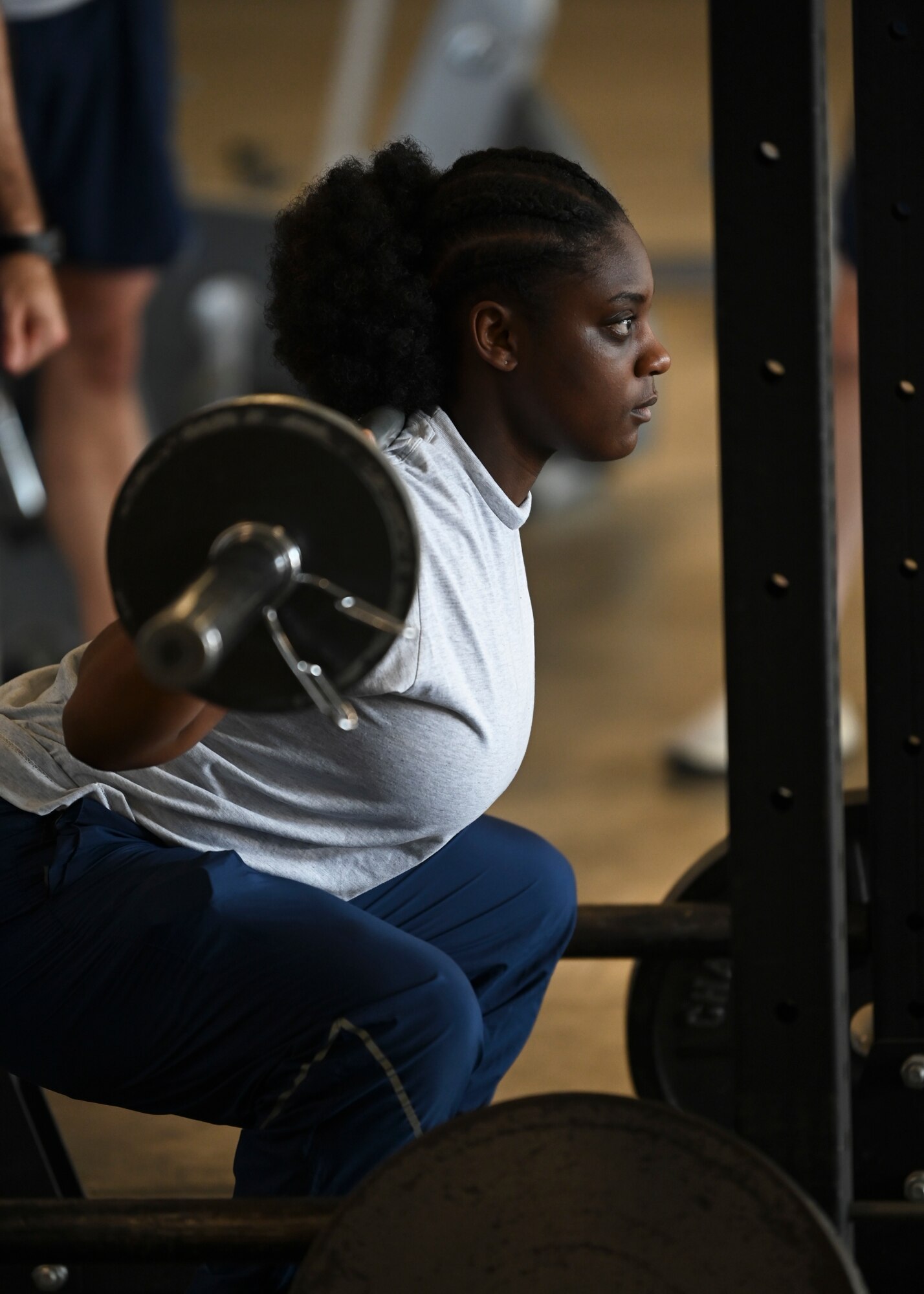 U.S. Air Force Airman 1st Class Serenity Williams, 62d Aerial Port Squadron passenger service agent, performs a back squat during a Warrior Heart Focus Day at Joint Base Lewis-McChord, Washington, June 28, 2023. The 62d APS hosted resiliency of events, focused on building the best versions of their Airmen. The events included classes for diet and nutritional cooking, crossfit and weight training, sleep and fatigue support, stress management, spiritual resiliency, physical therapy, mindfulness and a running clinic. (U.S. Air Force photo by Senior Airman Callie Norton)