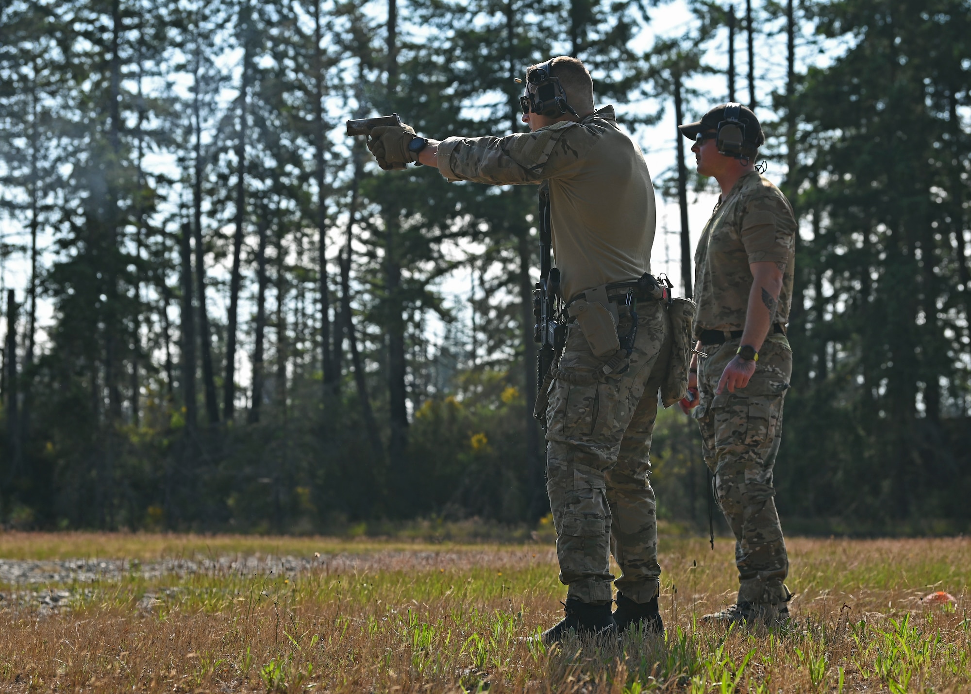 U.S. Air Force Capt. Roger Knizat, tactical air control party officer with the 5th Air Support Operations Squadron, fires an M18 weapon system during the Lowlife Challenge at Joint Base Lewis-McChord, Washington, June 22, 2023. TACPs and special warfare mission support Airmen with the 5th ASOS competed in a series of strenuous mental and physical challenges during the Lowlife Challenge including an obstacle course, tactical shooting, monster mash and land navigation. (U.S. Air Force photo by Senior Airman Callie Norton)