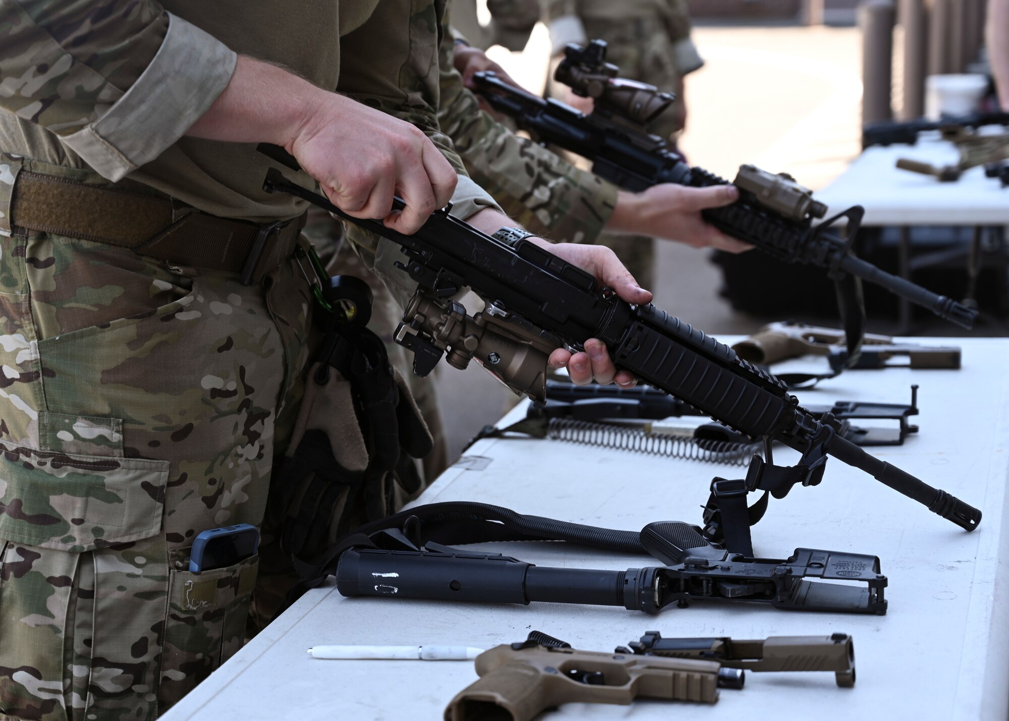 U.S. Air Force tactical control party Airmen with the 5th Air Support Operations Squadron assemble M4 weapon systems during the Lowlife Challenge at Joint Base Lewis-McChord, Washington, June 22, 2023. TACPs and special warfare mission support Airmen with the 5th ASOS competed in a series of strenuous mental and physical challenges during the Lowlife Challenge including an obstacle course, tactical shooting, monster mash and land navigation. (U.S. Air Force photo by Senior Airman Callie Norton)