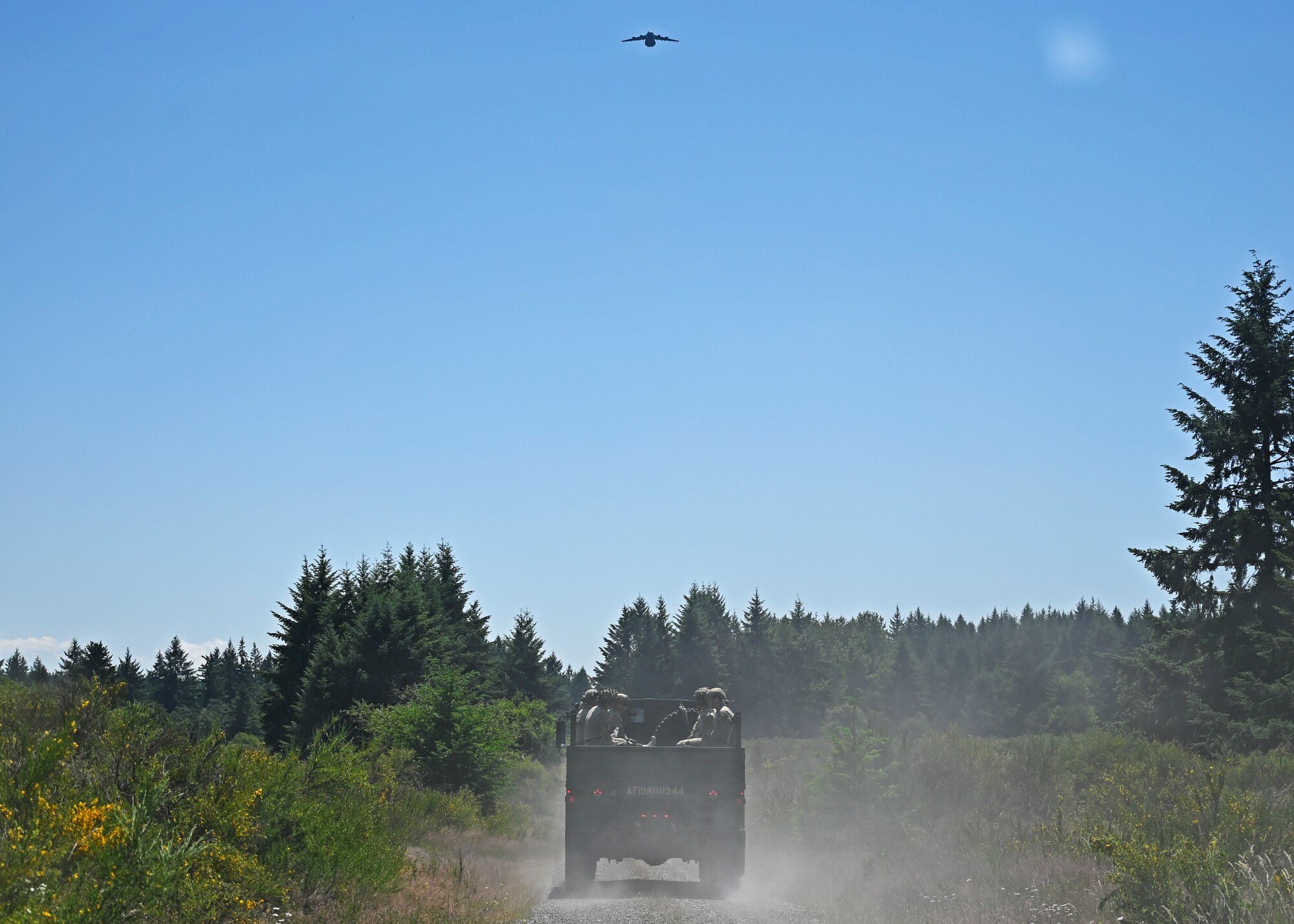 U.S. Air Force tactical air control party Airmen and special warfare mission support members with the 5th Air Support Operations Squadron, are transported to a land navigation site during the Lowlife Challenge at Joint Base Lewis-McChord, Washington, June 22, 2023. TACP and SWMS Airmen with the 5th ASOS competed in a series of strenuous mental and physical challenges during the Lowlife Challenge including an obstacle course, tactical shooting, monster mash and land navigation. (U.S. Air Force photo by Senior Airman Callie Norton)
