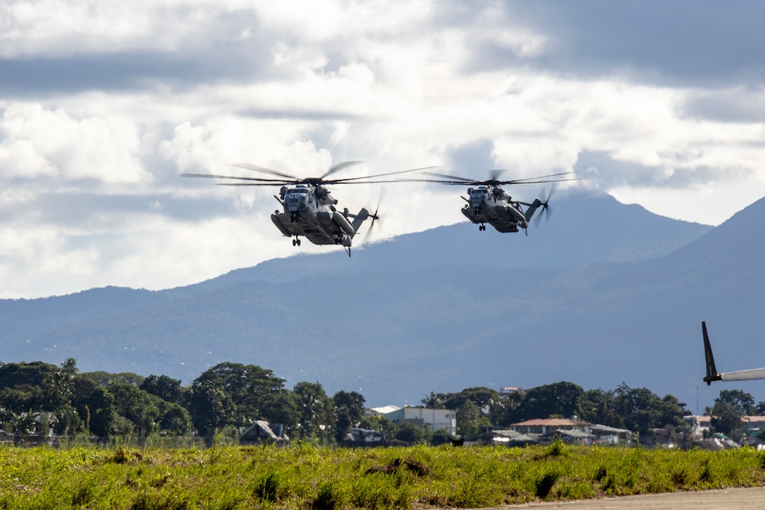 U.S. Marine Corps CH-53E Super Stallions attached to Marine Medium Tiltrotor Squadron 163 (Reinforced), Marine Aircraft Group 16, 3rd Marine Aircraft Wing, make a final approach to Antonio Bautista Air Base as part of
Marine Aviation Support Activity 23 in Puerto Princesa, Palawan, Philippines, July 6, 2023. MASA is a bilateral exercise between the Armed Forces of the Philippines and the U.S. Marine Corps, aimed at enhancing interoperability and coordination focused on aviation-related capabilities. During MASA 23, Filipino and U.S. Marines conduct approximately twenty different training evolutions, including live-fire, air assaults, and subject matter expert exchanges across aviation, ground, and logistics capabilities.