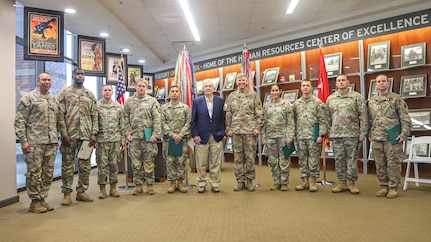 Sen. Mitch McConnell, center, stands with V Corps Soldiers after an awards ceremony during a visit to V Corps Headquarters, at Fort Knox, Kentucky, July 5, 2023. McConnell visited U.S. Army V Corps’ Headquarters to meet with corps leaders and to recognize Victory Corps soldiers for their recent military achievements. (U.S. Army photo by Spc. Devin Klecan)