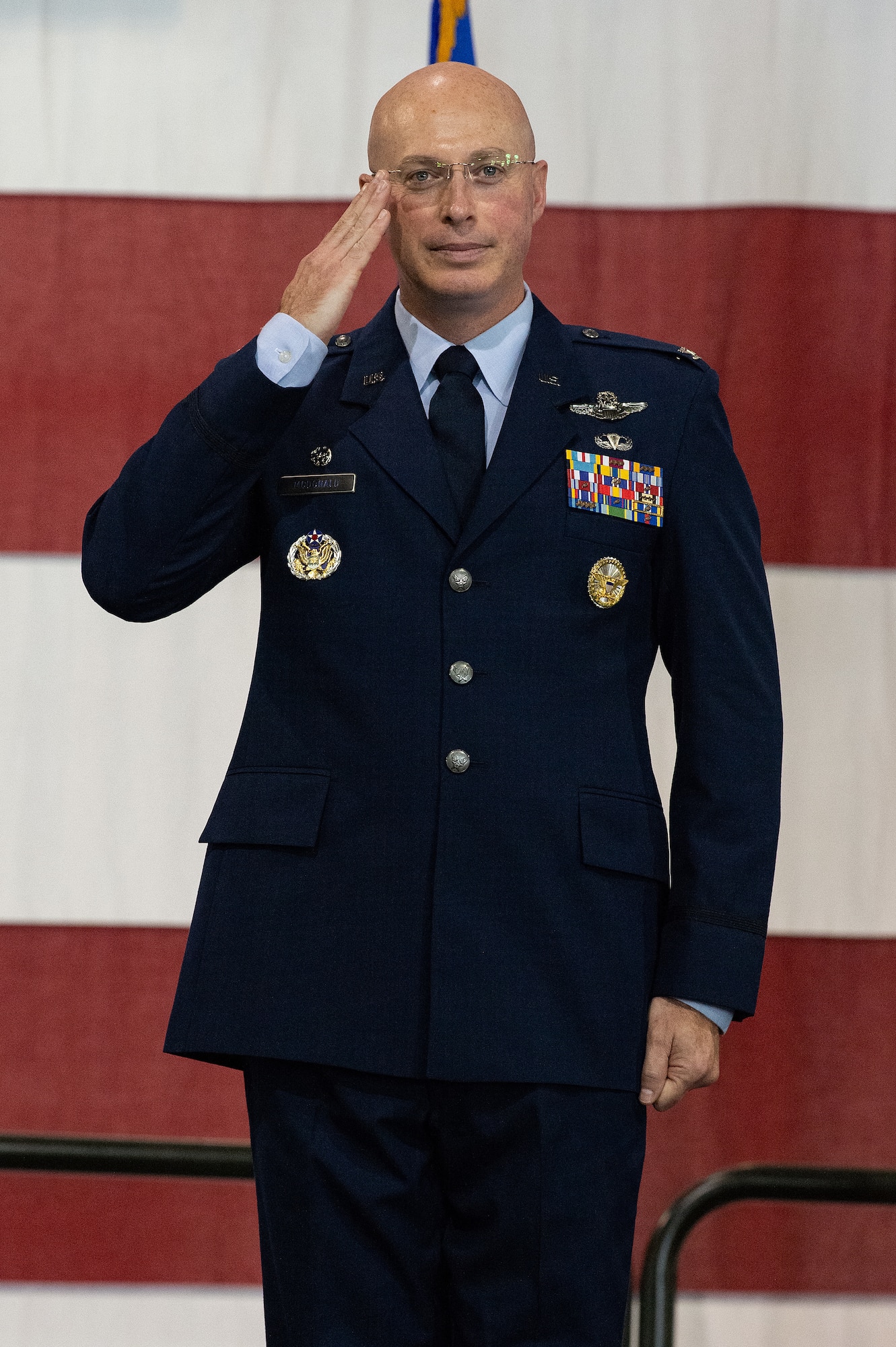 Col. William C. McDonald, 436th Airlift Wing commander, receives his first salute from a formation of Team Dover Airmen during the 436th AW Change of Command ceremony at Dover Air Force Base, Delaware, July 7, 2023. McDonald takes command following an assignment as the 89th AW vice commander at Joint Base Andrews, Maryland. (U.S. Air Force photo by Roland Balik)