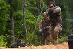 A Soldier with the 19th Special Forces Group, headquartered in the Utah Army National Guard, leads his team, which includes Latvian special operations elements, in an assault on a simulated emplaced missile launcher site while taking part in exercise Ridge Runner near Jolo, West Virginia, June 15, 2023. The two-week exercise brought together Soldiers with the 19th SFG and special operations troops from Latvia, Poland and other allied and partner nations and focused on interoperability in unconventional warfare tasks.