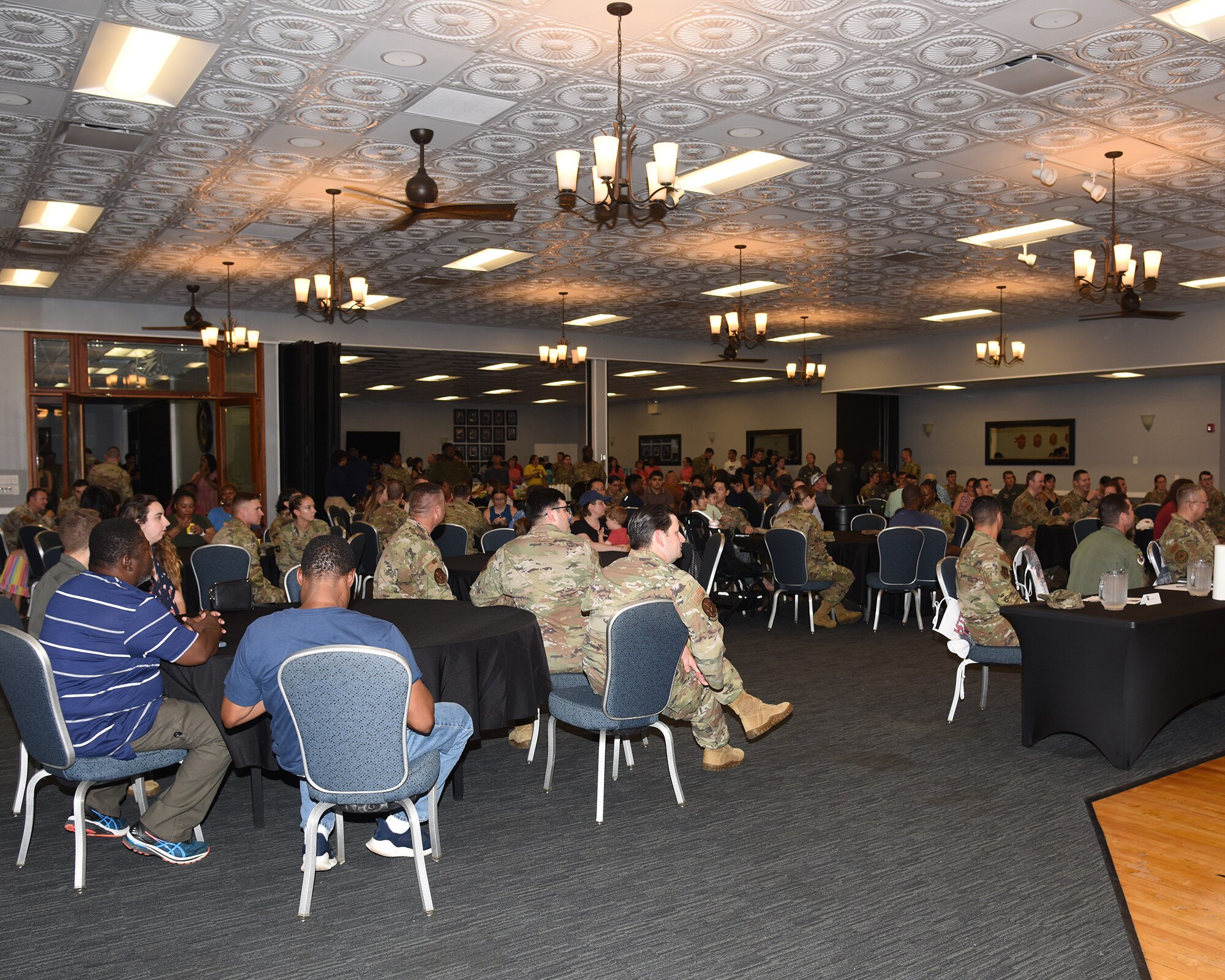 Airmen, civilian personnel and families gather for the inaugural Top Pitmaster BBQ cook-off.