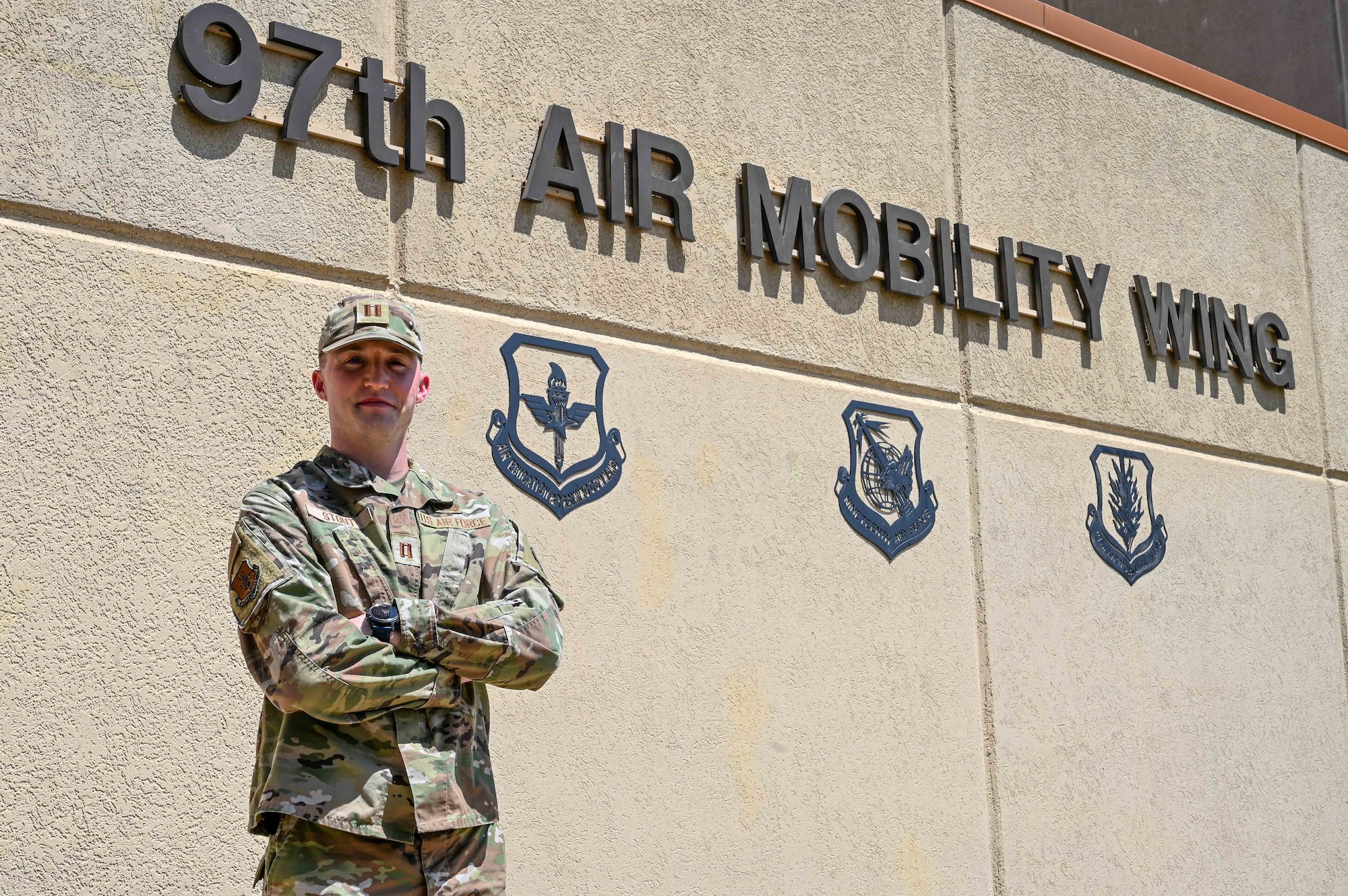 U.S. Air Force Capt. Tyler Stout, 97th Air Mobility Wing executive officer, poses for a photo outside his workplace at Altus Air Force Base, Oklahoma, June 29, 2023. Stout commissioned in 2019 from the United States Air Force Academy and plans to stay for the foreseeable future. (U.S. Air Force photo by Senior Airman Kayla Christenson)