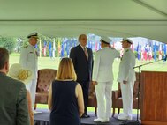 Rear Adm. Casey J. Moton, incoming Program Executive Officer for Aircraft Carriers (PEO CVN), salutes Frederick J. Stefany, Assistant Secretary of the Navy for Research, Development and Acquisition (Acting), with Rear Adm. James P. Downey, outgoing Program Executive Officer for Aircraft Carriers (PEO CVN) and RADM John Meier, U.S. Navy, Commander, Naval Air Force Atlantic, at the Washington Navy Yard, July 7.