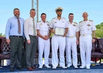 Adm. James F. Caldwell Jr., director, Naval Nuclear Propulsion Program, right, Royal Australian Navy Vice Adm. Jonathan Mead, director-general of the Australian Submarine Agency, Royal Australian Navy Lt. Cmdr Adam Klyne, Royal Australian Navy Vice Adm. Mark Hammond, Chief of Navy, the Honorable Erik Raven, Under Secretary of the Navy, and Abraham M. Denmark, Senior Advisor to the Secretary of Defense for AUKUS, pose for a photo during a United States Naval Nuclear Power School (NPS) graduation ceremony at Naval Nuclear Power Training Command (NNPTC), July 7, 2023. Three Royal Australian Navy (RAN) officers graduated NPS, marking a significant step in Australia's goal to operate conventionally-armed, nuclear-powered attack submarines (SSNs). (U.S. Navy photo by Mass Communication Specialist 2nd Class Dart D. De La Garza)