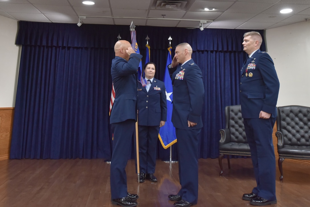Col. John Hollister salutes Brig. Gen. George Dietrich III as he assumes command of 82nd MSG.