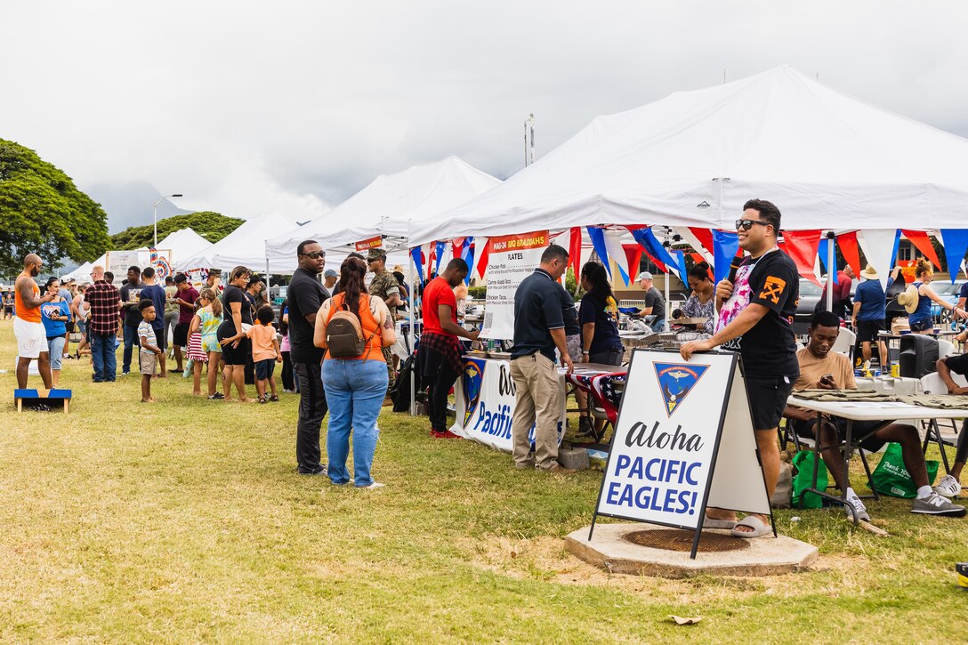 U.S. Marines with Marine Aircraft Group 24, 1st Marine Air Wing, compete and fundraise during the K-Bay Barbecue Bash, Marine Corps Base Hawaii, June 30, 2023. The event was held to bring the community together and encourage healthy competition among the base's tenant units, fostering camaraderie and unity. (U.S. Marine Corps photo by Cpl. Brandon Aultman)