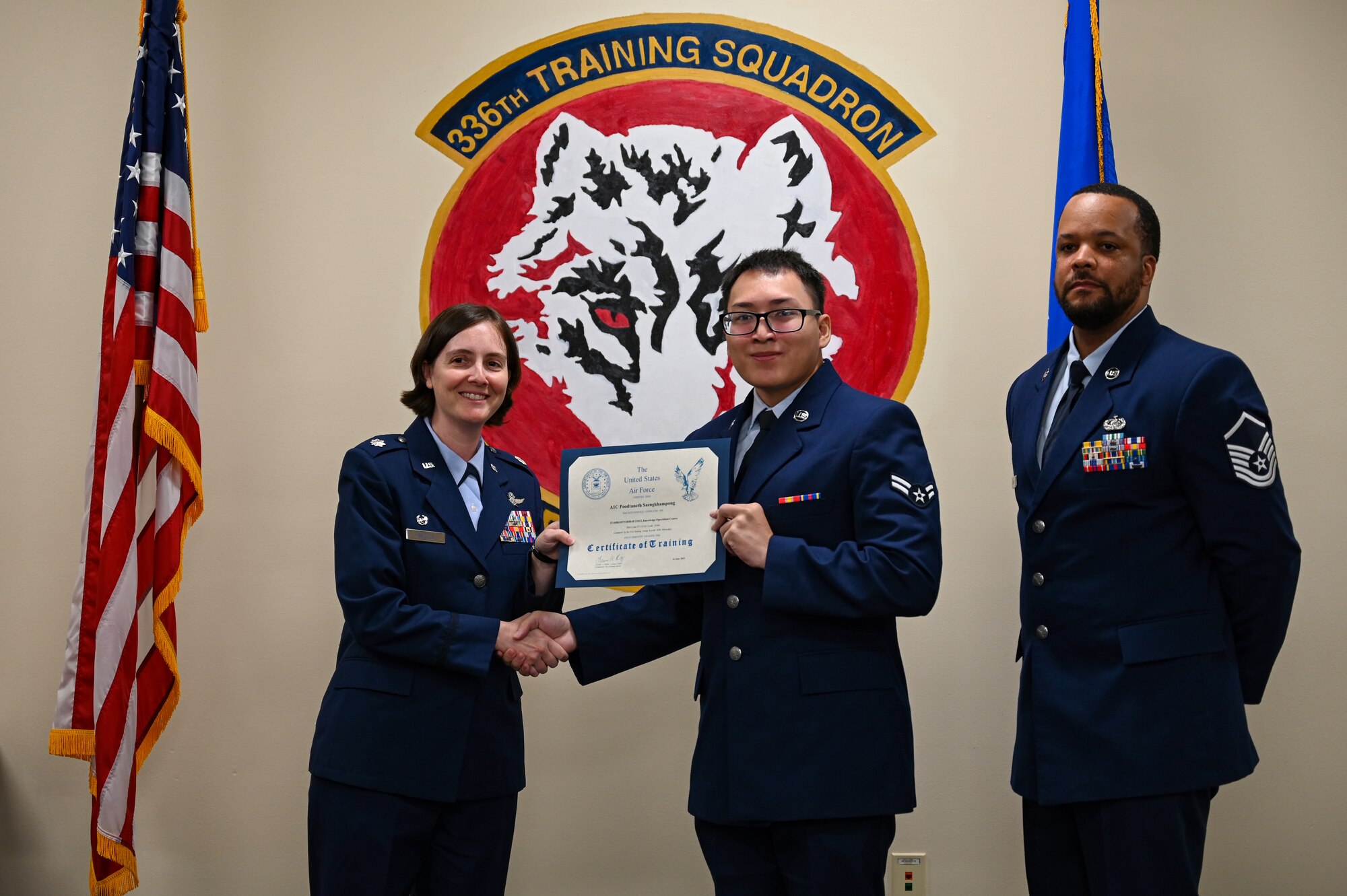U.S Air Force Lt. Col. Jennifer Weller, 336th Training Squadron commander, Airman 1st Class Poodthaneth Saengkhamphong, 336th TRS knowledge operations course graduate, and Master Sgt. Jacee Lawary, 336th TRS systems operations section chief, pose for photo on Keesler Air Force Base, Mississippi, June 16th, 2023.