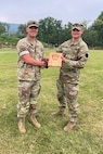 Staff Sgt. Michael Sessamen, right, of Headquarters and Headquarters Battalion, 28th Infantry Division receives the High New Shooter Award from Capt. Shawn Garghill, chief of the Pennsylvania Army National Guard Individual Training Branch, at the conclusion of the annual Governor’s Twenty marksmanship competition July 1, 2023, at Fort Indiantown Gap, Pa. (Courtesy photo)