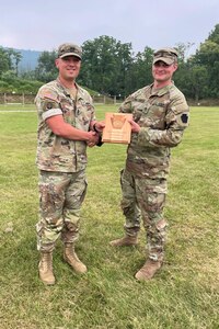 Staff Sgt. Michael Sessamen, right, of Headquarters and Headquarters Battalion, 28th Infantry Division receives the High New Shooter Award from Capt. Shawn Garghill, chief of the Pennsylvania Army National Guard Individual Training Branch, at the conclusion of the annual Governor’s Twenty marksmanship competition July 1, 2023, at Fort Indiantown Gap, Pa. (Courtesy photo)