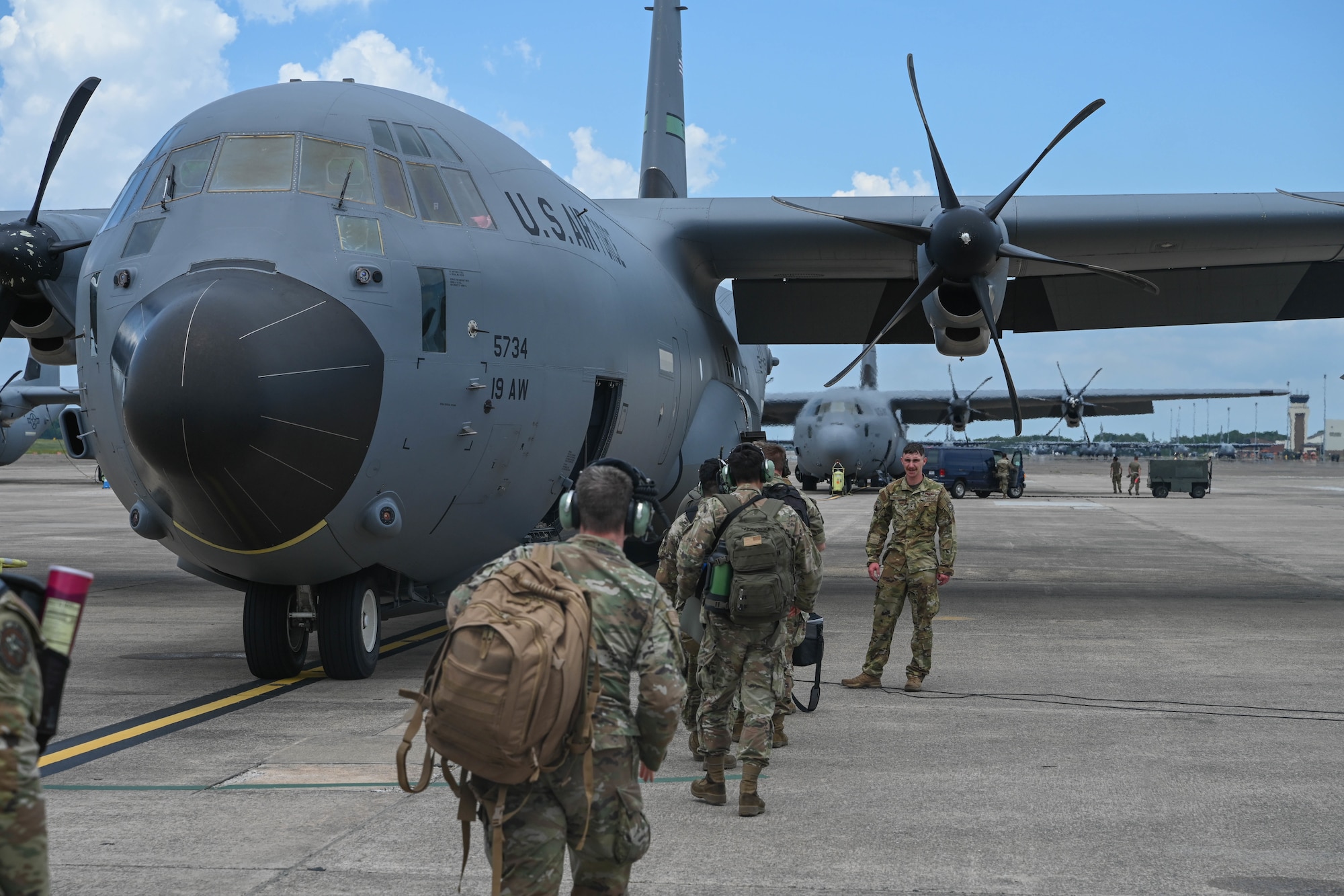 Airmen load onto a C-130J Super Hercules to head to an exercise