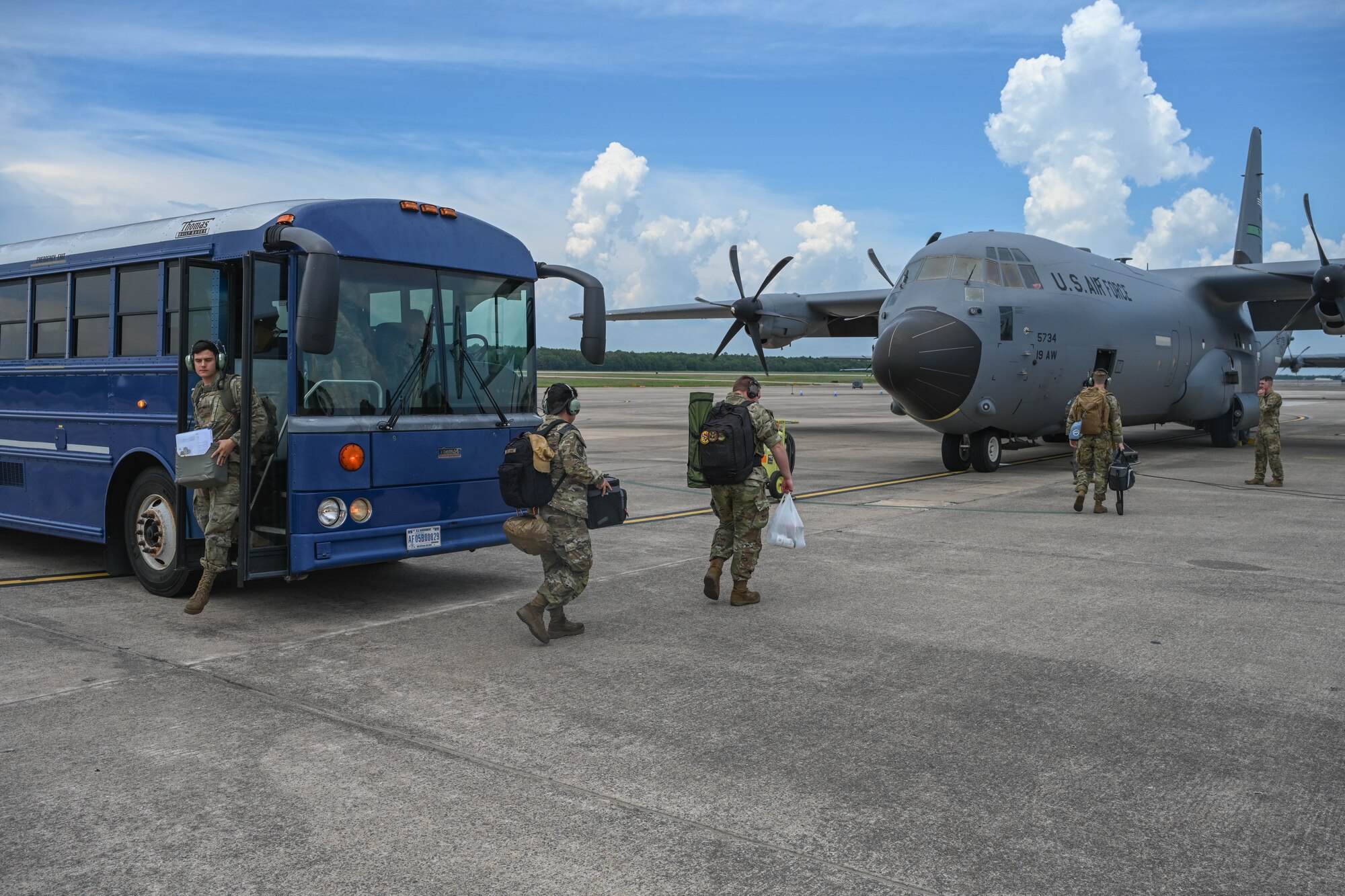 Airmen load onto a C-130J Super Hercules to head to an exercise
