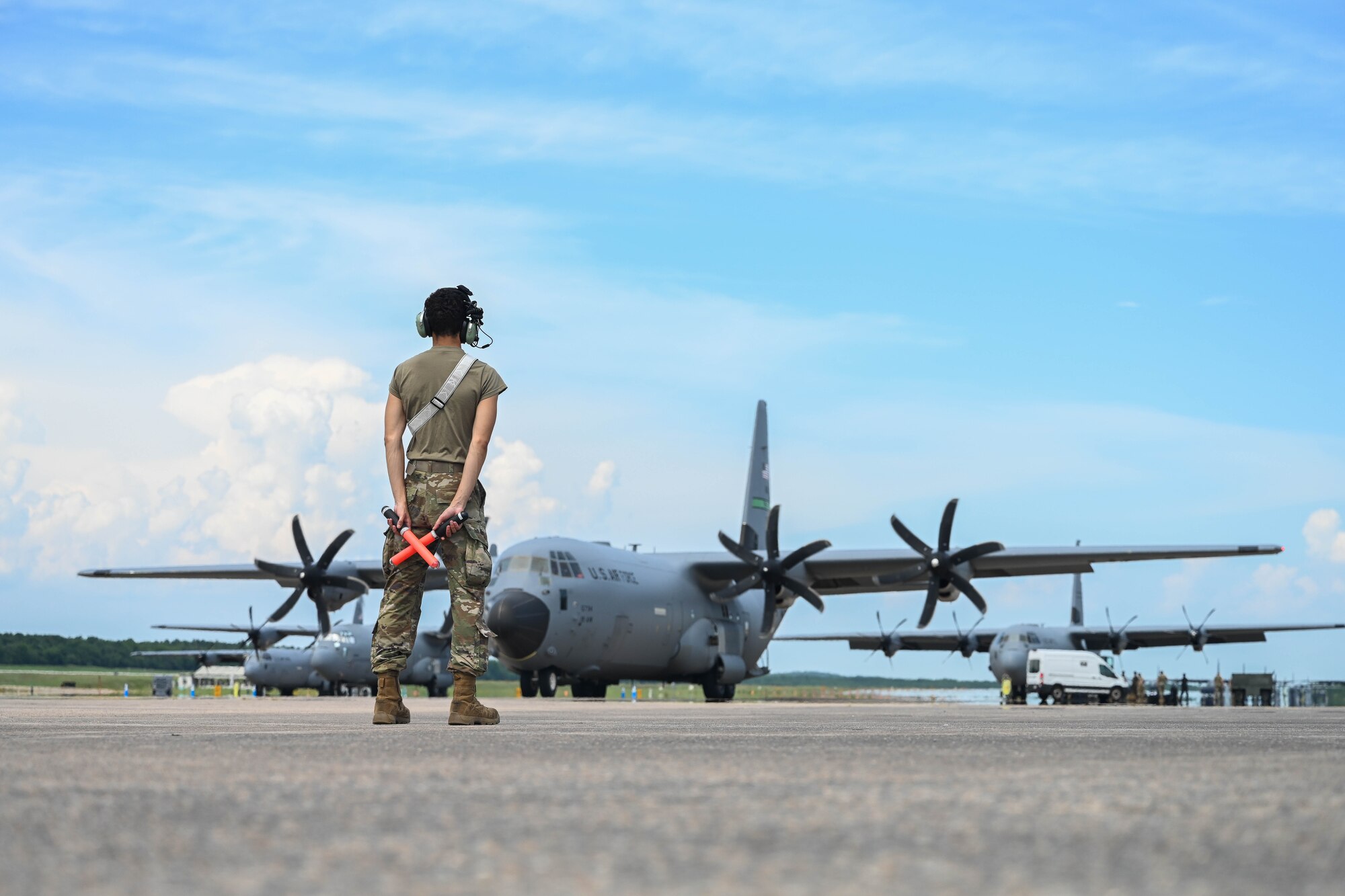 Airmen load onto a C-130J Super Hercules to head to an exercise