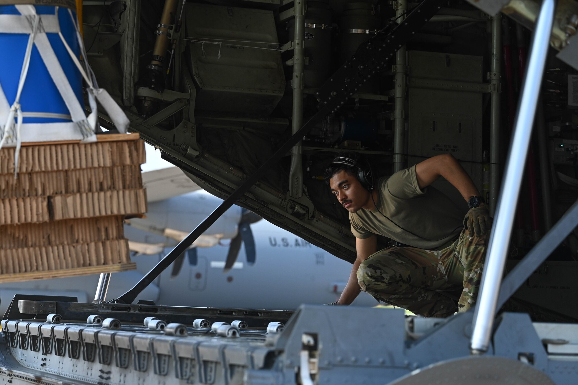 Airmen load onto a C-130J Super Hercules to head to an exercise