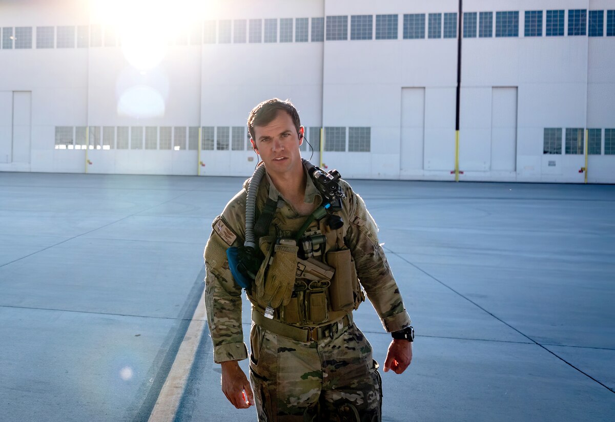 Maj. Kyle Konkolics, 71st Special Operations Squadron safety chief, prepares to board a CV-22 Osprey May 10, 2023, at Kirtland Air Force Base, N.M. Konkolics received the Distinguished Flying Cross for his heroic role in a rescue mission of an American hostage in Africa in October 2020. The successful operation was the longest-distance hostage rescue conducted during night in the Department of Defense history and was completed within 48 hours of their initial notification. (U.S. Air Force photo by Allen Winston)