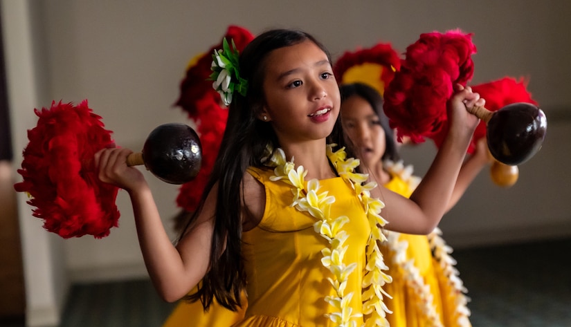 Children from the Te Ori O Keone Ti’ a Mai – Hula/Tahitian Halau group perform a traditional Hawaiian dance during the Diversity, Equity, Inclusion and Accessibility summer expo at Joint Base Langley-Eustis, Virginia, June 30, 2023.