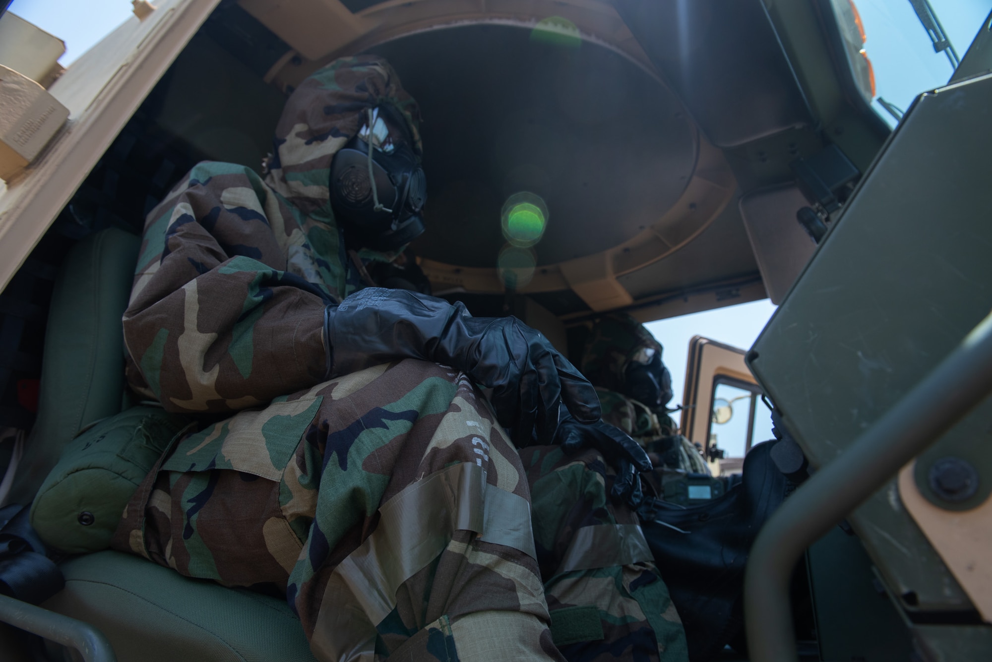 U.S. Air Force 55th Combat Communications Squadron Airmen test their Mission Oriented Protective Posture (MOPP) gear while operating a Light Medium Tactical Vehicle (LMTV), June 21, 2023, at Tinker Air Force Base, Oklahoma. Members train in MOPP gear in order to deploy to any environment and perform at-home operations, and Airmen tested many tasks throughout Exercise AGILE BLIZZARD UNIFIED VISION. (U.S. Air Force photo by 1st Lt. Hailey Malay)