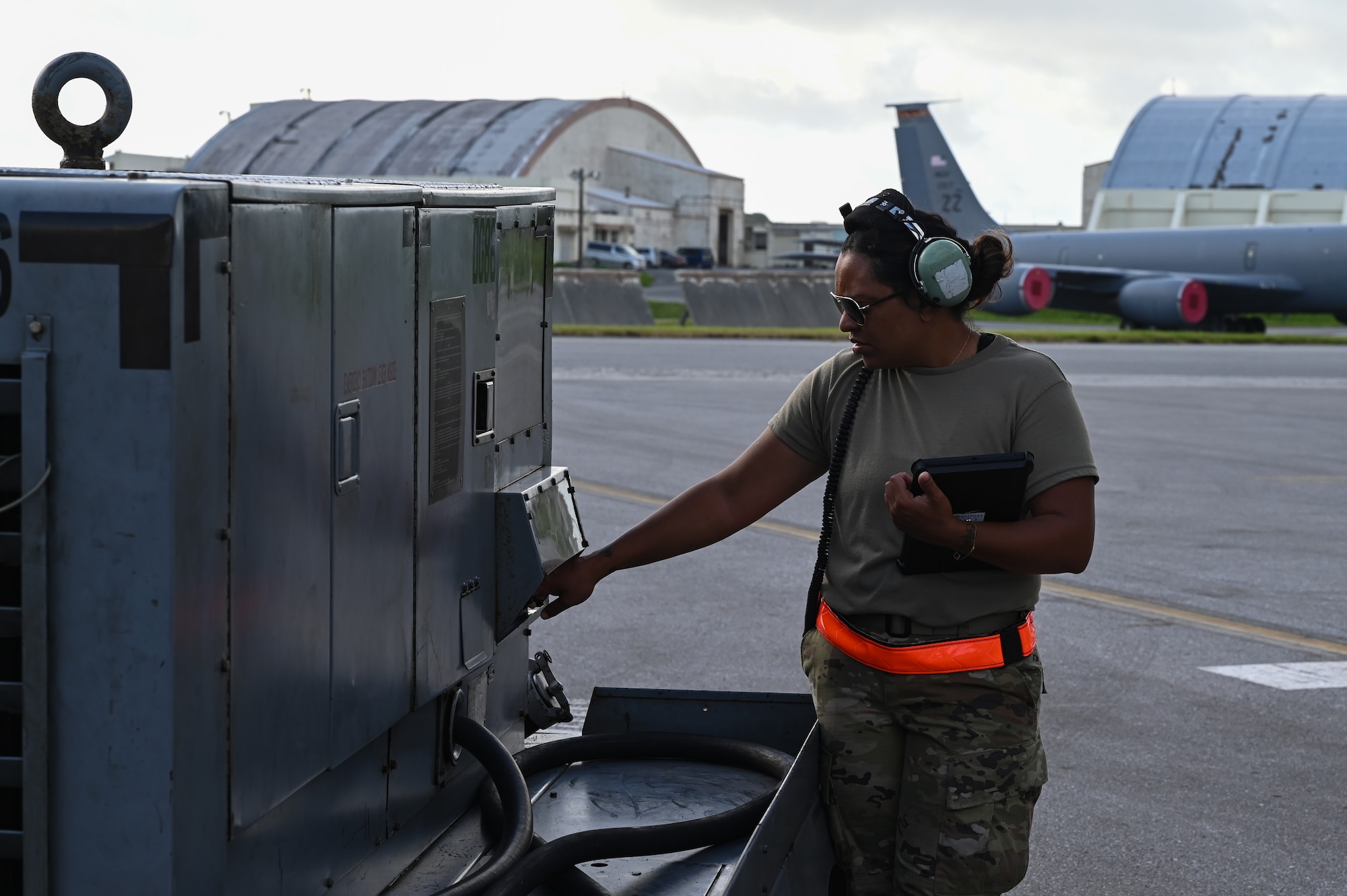 An Airman starts a power cart.