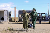 Alaska Army National Guard Staff Sgt. Fabiana Kirtley, left, survey team chief, and Alaska Air National Guard Tech Sgt. Conrad Slocum, survey team member, both with the 103rd Weapons of Mass Destruction - Civil Support Team, prepare for initial entry into a notional lab believed to be capable of manufacturing biological weapons at the Nome, Alaska, Fire Training Center as part of Exercise ORCA 2023, June 12. During initial entry the team uses handheld radiation and nerve, blister, and blood agent detectors as part of the site characterization process. The biennial exercise includes units from five other states and is part of the CST’s routine training schedule, designed to maintain readiness, validate response procedures, and collaborate with community first response agencies across the state.