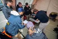 Agents with the Anchorage FBI Evidence Response Team collaborate with members of the Mississippi National Guard’s 47th Weapons of Mass Destruction-Civil Response Team on evidence collection for a notional lab consisting of simulated biological agents that could be used in the manufacture of biological weapons at the Anchorage Fire Department Fire Training Center in Anchorage, Alaska, June 13, 2023. The emergency response training is part of ORCA 2023, a biennial exercise designed to maintain readiness, validate response procedures, and collaborate with first response agencies across the state. The exercise, hosted by the Alaska National Guard’s 103rd WMD-CST, included 12 National Guard units from Alaska, Washington, Nebraska, Mississippi, Kansas, Ohio, Hawaii, and Kentucky, eight local and state entities, three federal agencies, and various community partners.