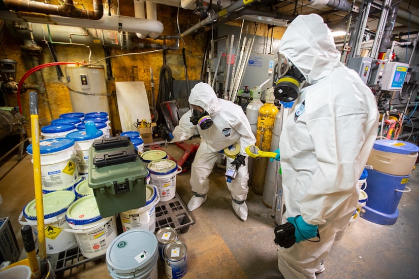 Team members with the Washington National Guard’s 10th Weapons of Mass Destruction - Civil Support Team, work through an emergency scenario consisting of a simulated radiological weapon that could be used in the manufacture of a dirty bomb on the University of Alaska Anchorage campus June 13, 2023. The emergency response training is part of ORCA 2023, a biennial exercise designed to maintain readiness, validate response procedures, and collaborate with first response agencies across the state.