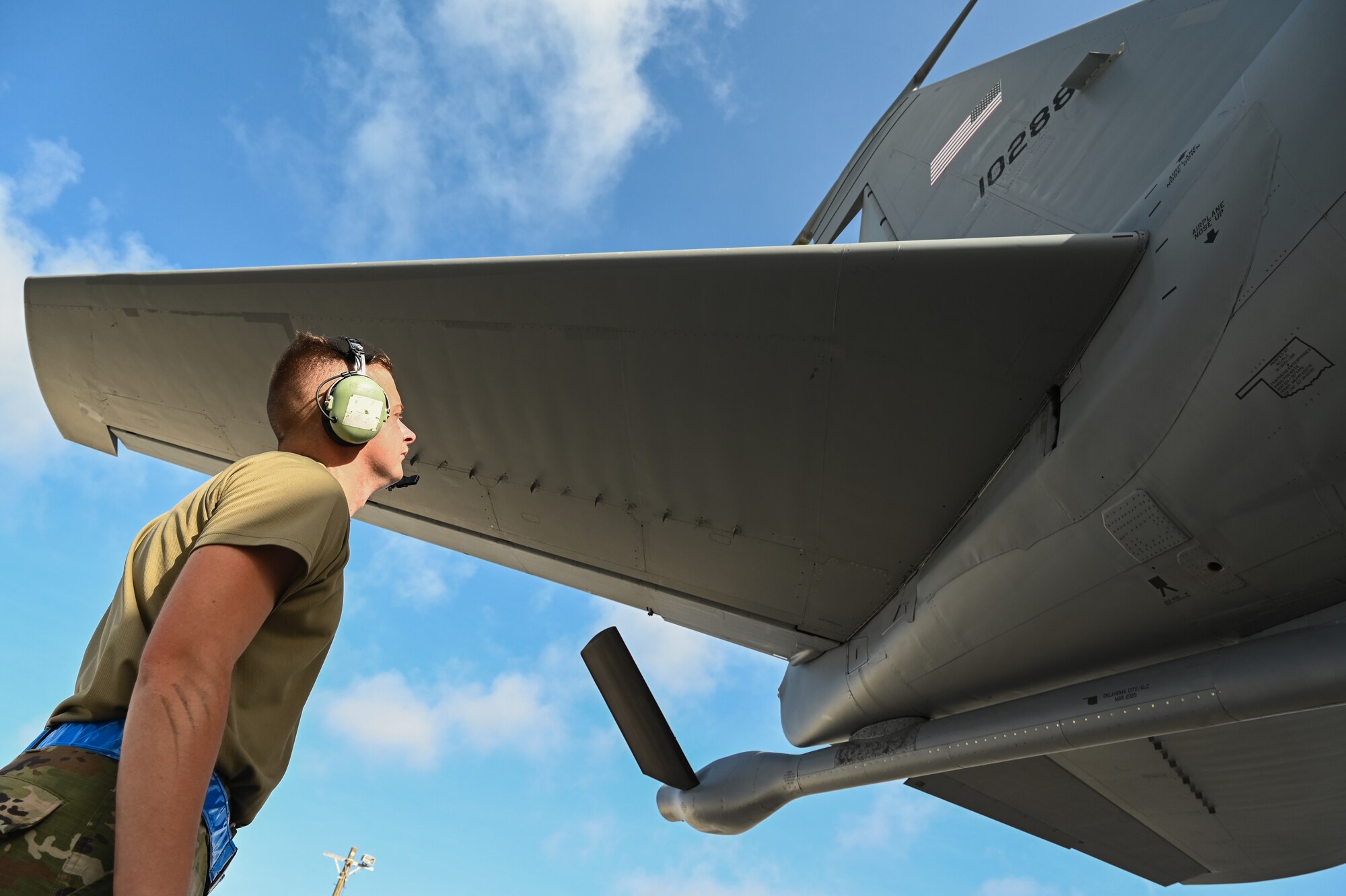 An Airman inspects an aircraft.