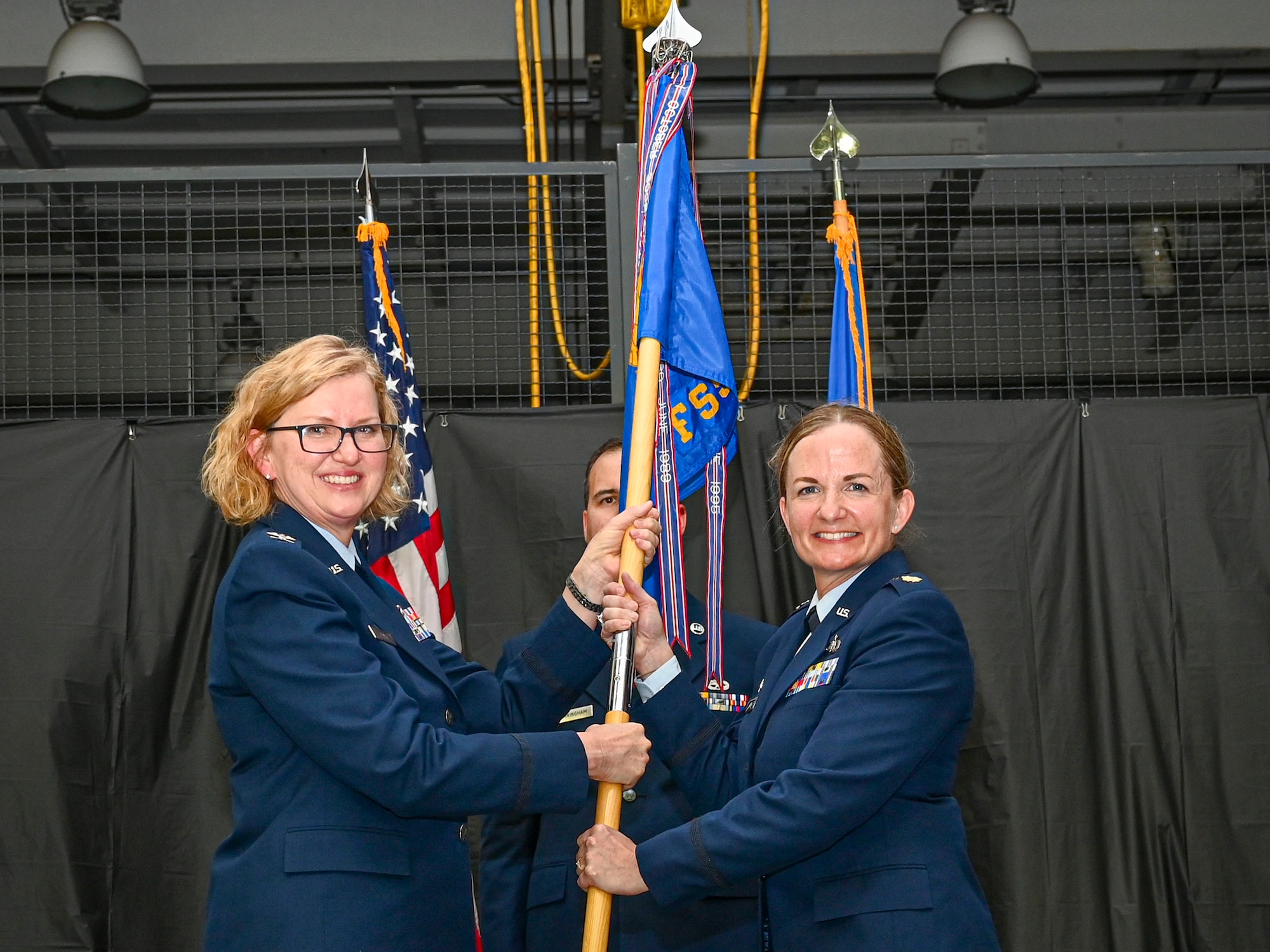 Maj. Deborah Hautanen (right) assumes command of the 512th Force Support Squadron from Col. Crystal Beach, 512th Mission Support Group commander, at Dover Air Force Base, Delaware, July 8, 2023. Hautanen leads Reserve Citizen Airmen responsible for providing military, civilian and family personnel services, deployment readiness actions, communication support and education and training programs to 512th Airlift Wing members. (U.S. Air Force photo by Senior Airman Shayna Hodge)