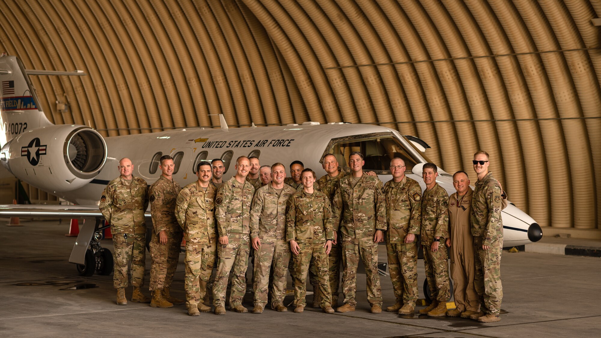 Photo of a group of Airmen in front of an aircraft