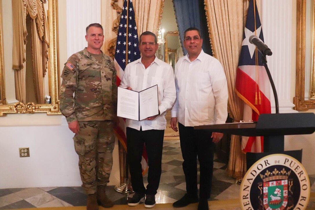 Brig. Gen. Daniel Hibner, U.S. Army Corps of Engineers, South Atlantic Division Commander, and Eng. Josué Colón, Executive Director of the Puerto Rico Electric Power Authority, sign a Memorandum of Agreement to implement the permanent repairs of the Guajataca Dam in Isabela.