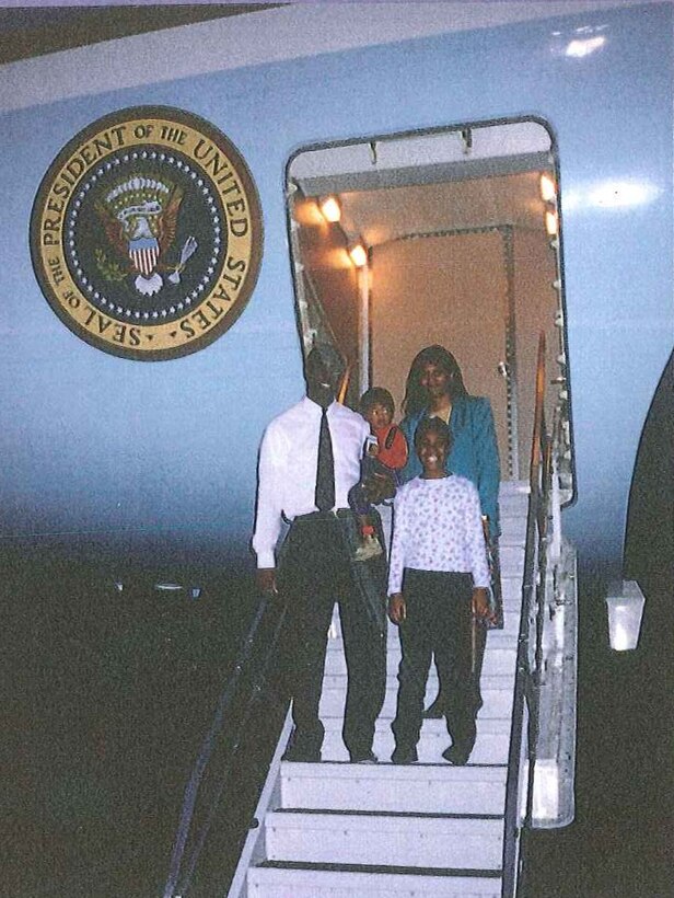 Michael Flynn and family pose for a photo on the steps of Air Force One at Ellington Field, during a presidential visit in the 1990s.