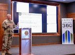 Lt. Col. Mark Williams, supervisory contract specialist, U.S. Property and Fiscal Office for Illinois, presents a brief overview of the basic requirements for a business to participate in government contracting programs during the Camp Lincoln 117th anniversary commemoration July 6.