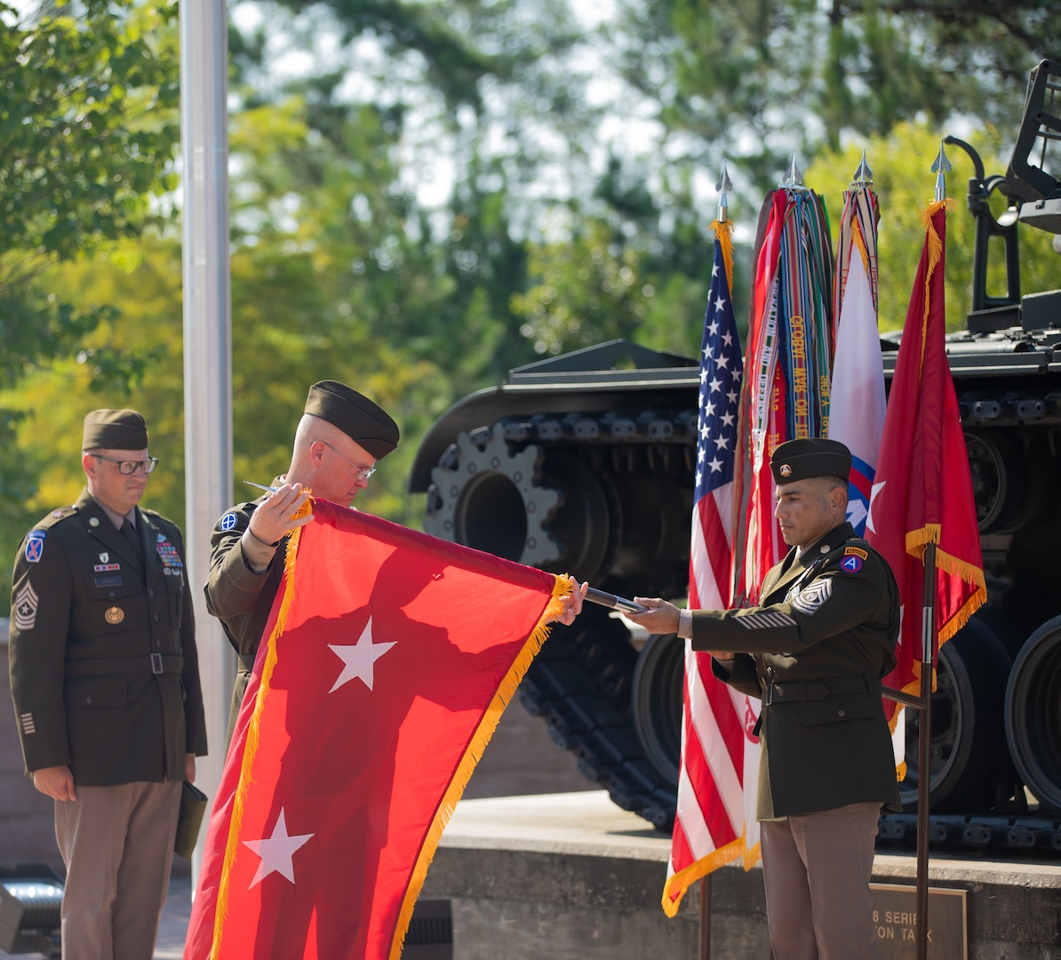 Maj. Gen. Henry S. Dixon, U.S. Army Central's Deputy Commanding General, is presented his ‘two-star’ general officer flag during his promotion ceremony at Shaw Air Force Base, S.C., July 07, 2023. Dixon was promoted to the rank of major general during the ceremony.