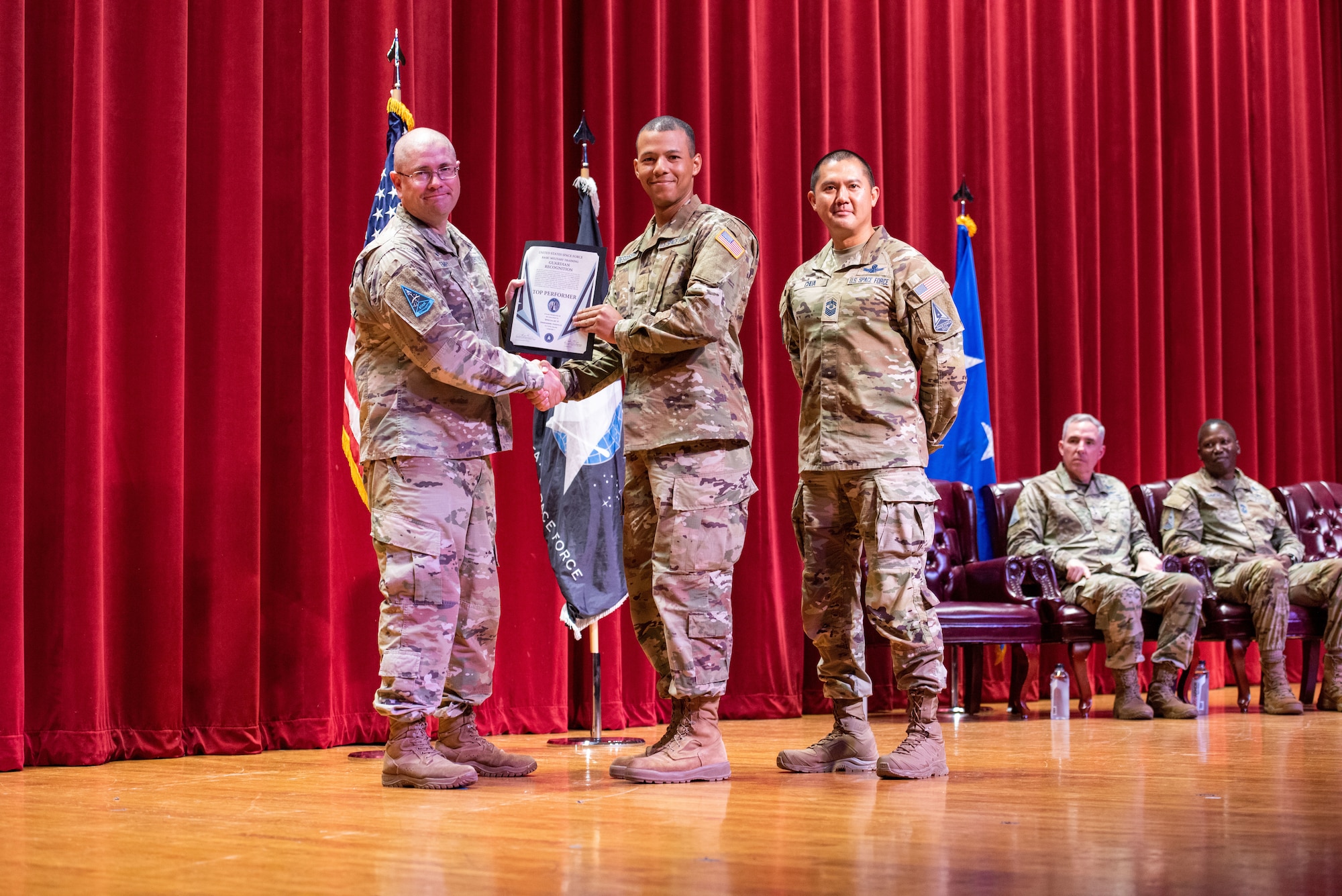 U.S. Space Force Specialist 3 Dakota Desrosiers, all-source intelligence analyst, receives the USSF Basic Military Training (BMT) Top Performer award during a private patching ceremony at Joint Base San Antonio–Lackland, Texas, on June 20, 2023. Desrosiers is the first USSF-trained Guardian to receive both the USSF Top Performer Award and Top BMT Graduate award.