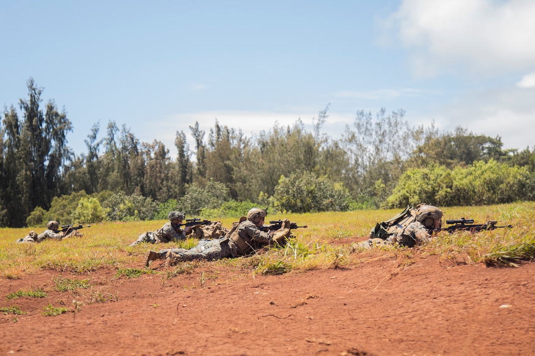 U.S. Marines with Advanced Infantry Training Battalion, School of Infantry-West, Hawaii Detachment, secure a landing zone during an Advanced Infantry Marine Course, Kahuku Training Area, Hawaii, June 26, 2023. AIMC is advanced infantry training designed to enhance and test Marines’ skills with a focus on reinforcing proper patrols and operational procedures. (U.S. Marine Corps photo by Lance Cpl. Terry Stennett III)