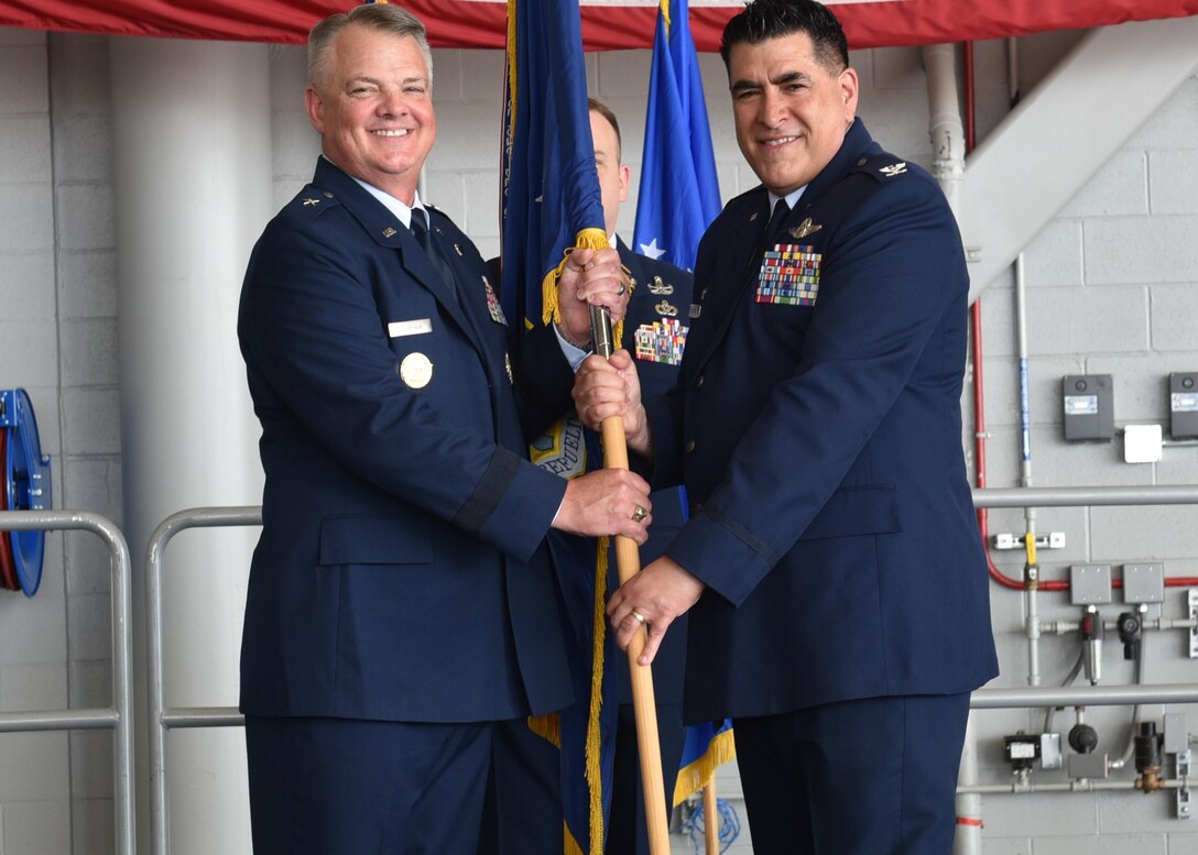 Col. Joseph Contino (right) receives the 914th Air Refueling Wing guidon and command of the unit from Brig. Gen. D. Scott Durham, 4th Air Force commander, during a change of command ceremony July 7, 2023 at Niagara Falls Air Reserve Station, New York.