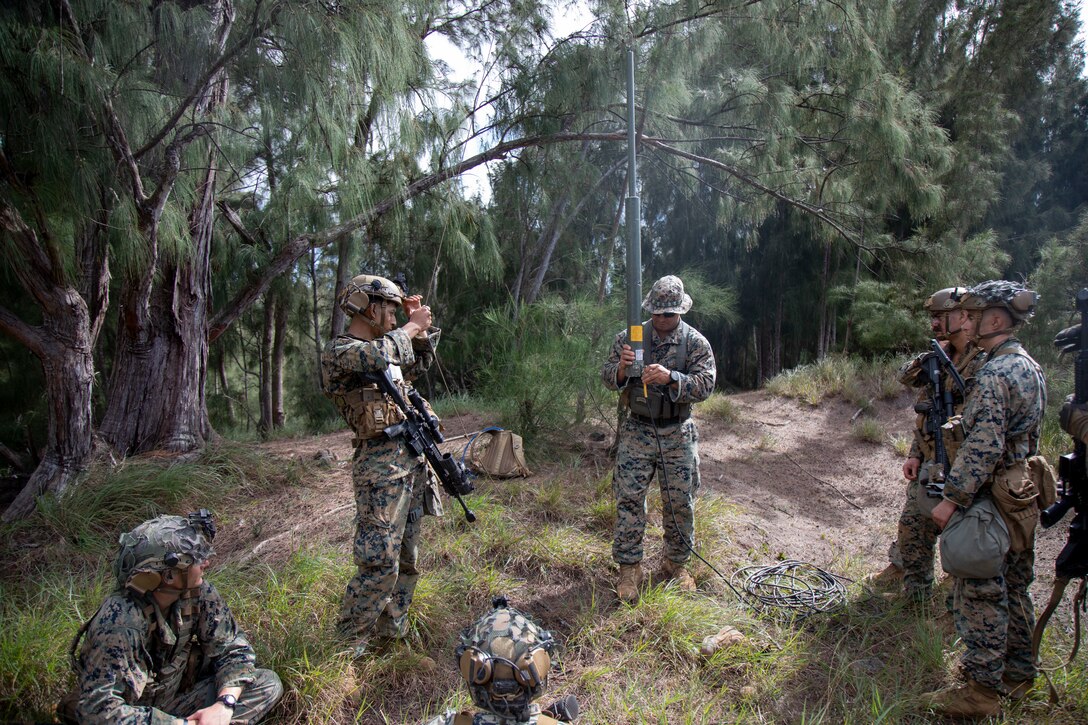 U.S. Marines with Advanced Infantry Training Battalion, School of Infantry-West, Hawaii Detachment, receive a class on long range communications during an Advanced Infantry Marine Course, Kahuku Training Area, Hawaii, June 26, 2023. AIMC is advanced infantry training designed to enhance and test Marines’ skills with a focus on reinforcing proper patrols and operational procedures. (U.S. Marine Corps photo by Lance Cpl. Terry Stennett III)