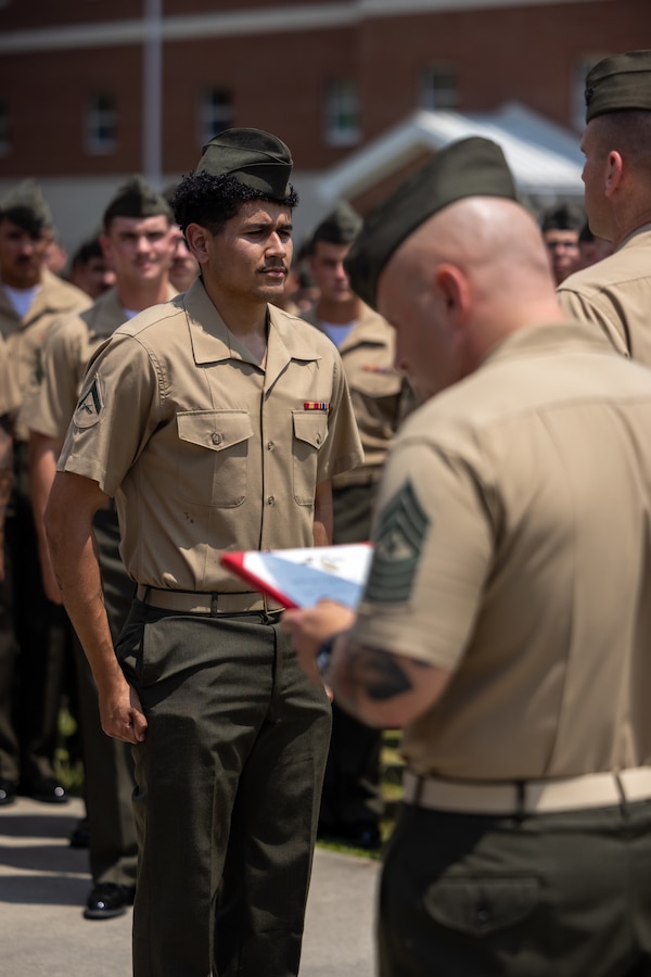 U.S. Marine Corps Lance Cpl. Joshua Diaz, a Miami native and rifleman with 2d Battalion, 8th Marines, 2d Marine Regiment, 2d Marine Division, receives an award during an award ceremony on Camp Lejeune, North Carolina, June 30, 2023. Diaz was awarded a Navy and Marine Corps Achievement Medal for saving a family after a motor vehicle collision in Atkinson, North Carolina. (U.S. Marine Corps photo by Lance Cpl. Ryan Ramsammy)
