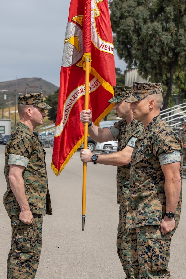 U.S. Marine Corps Lt. Col. James Woulfe, center, the outgoing commanding officer for Headquarters and Support Battalion, School of Infantry West, receives the colors from Sgt. Maj. Joseph Powers, left, the sergeant major of H&S Bn., SOI-West, during a change of command ceremony at the SOI-West parade deck on Camp Pendleton, June 29, 2023. Woulfe relinquished command to Lt. Col. Kurt Stahl, the incoming commanding officer. H&S Bn., SOI-West provides the operational, administrative, logistical, and legal services necessary to support the School of Infantry's training units. (U.S. Marine Corps photo by Lance Cpl. Mhecaela J. Watts)