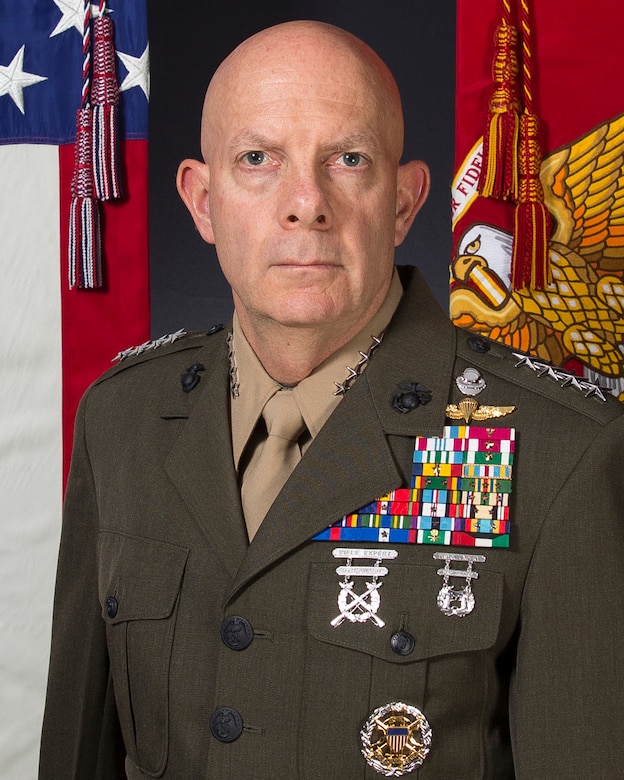 A man is photographed in his military dress uniform.