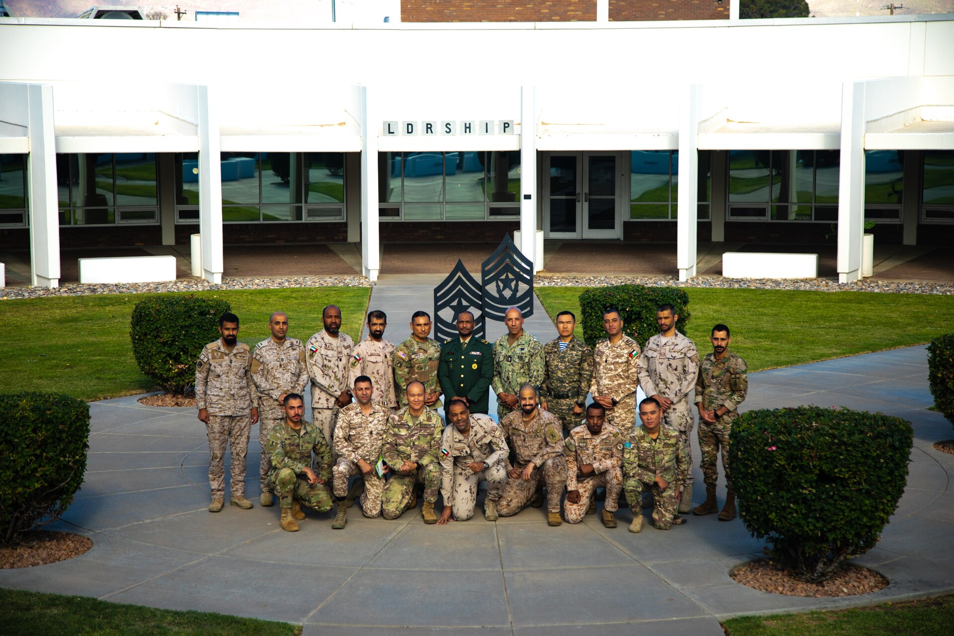 Fleet Master Chief Derrick Walters and Command Sgt. Maj. J Garza meet with class 73 and 74 of the international student program at the NCO Center of Excellence