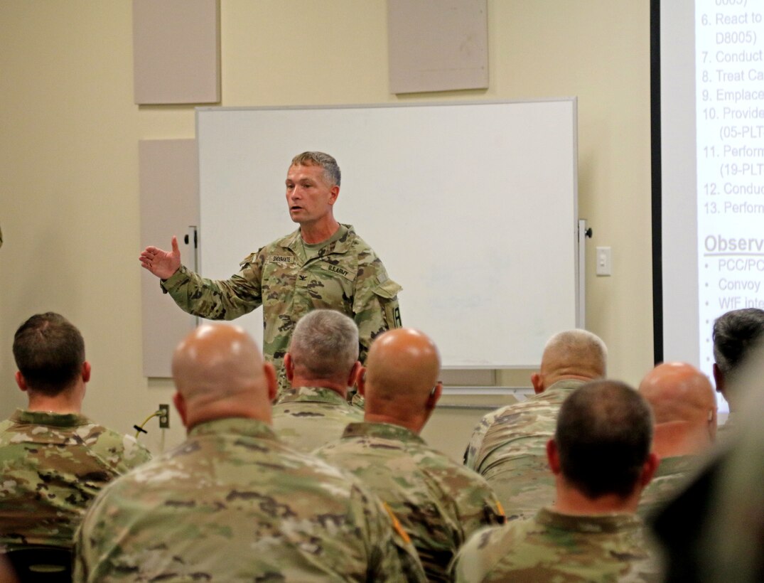 Col. William Shoemate II, the 188th IN BDE commander, asks questions to the senior leaders of the 30th Armored Brigade Combat Team about their challenges within the eXportable Combat Training Capability during the final after-action review on Fort Stewart June 28, 2023.