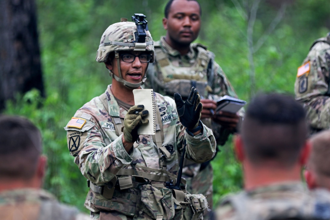 Sgt 1st Class Jose Posada, an OC/T assigned to 3rd Battalion, 395th Armored Regiment, 188th Infantry Brigade conducts an after-action review with the Soldiers of 4th Battalion, 118th Infantry Regiment during an eXportable Combat Training Capability on Fort Stewart, June 15, 2023.